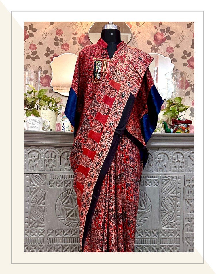 https://theethnictree.com/wp-content/uploads/2023/09/Blue-and-Madder-Ajrakh-print-modal-silk-saree-with-kaftan-blouse-01.jpg